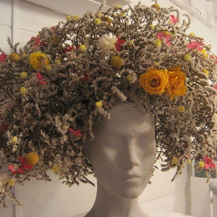 Sculptural botanical headpiece displayed on a mannequin